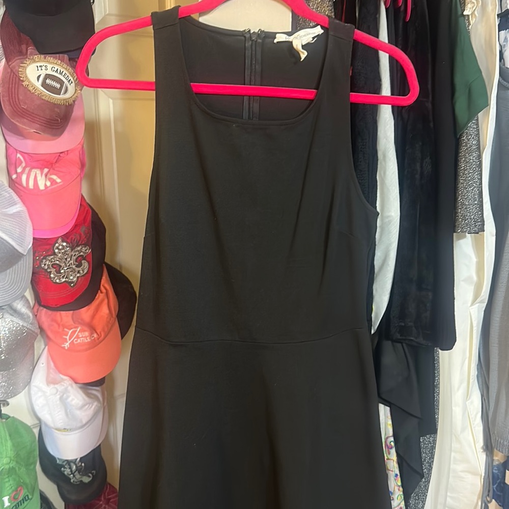 Very flattering little black dress.  BCBG